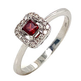 Anillo de granate con diamantes en oro blanco 10kt.