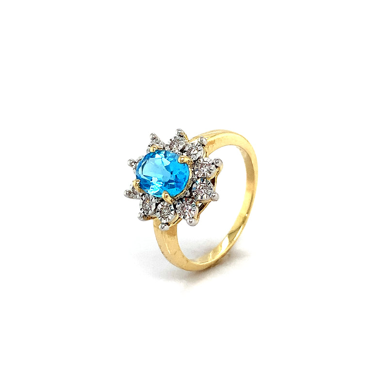 Anillo de topacio azul con diamantes en oro amarillo 10kt.