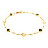 Pulsera (trébol nacar blanco y onix negro) en amarillo 18k. 19cm