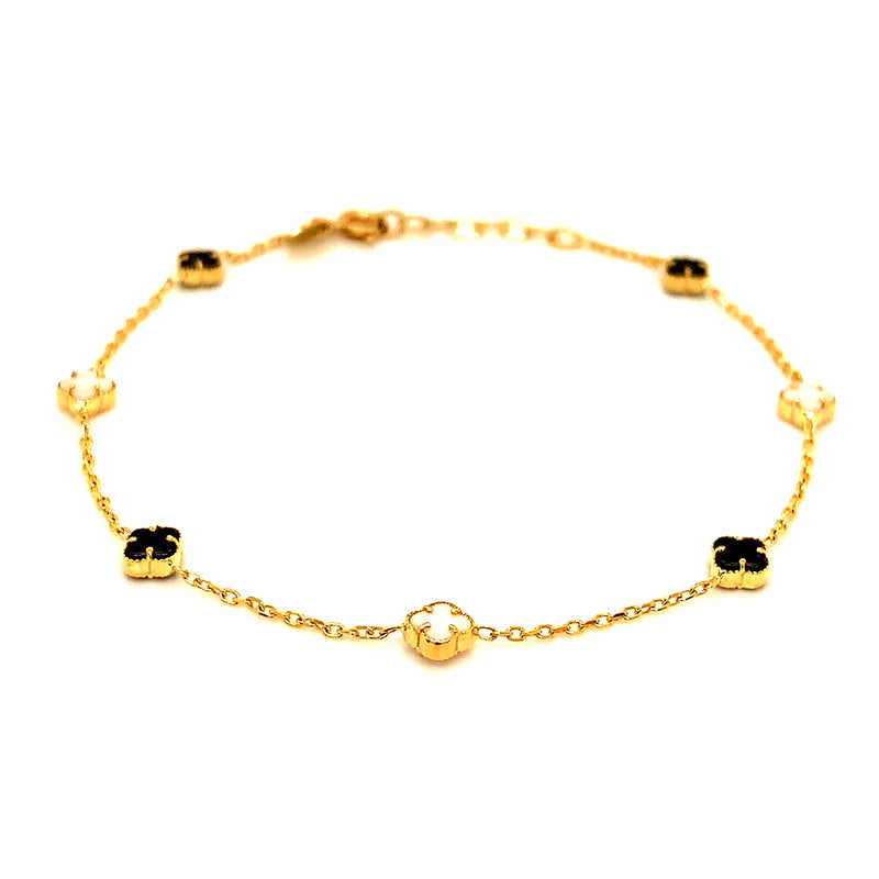 Pulsera (trébol nacar blanco y onix negro) en amarillo 18k. 19cm