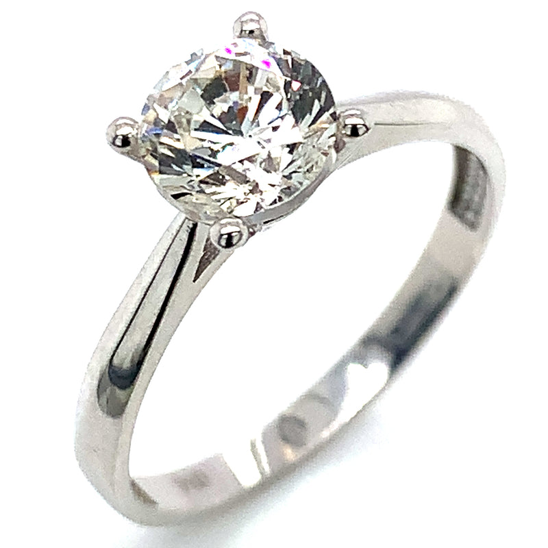 Anillo solitario con circón en oro blanco 18kt.