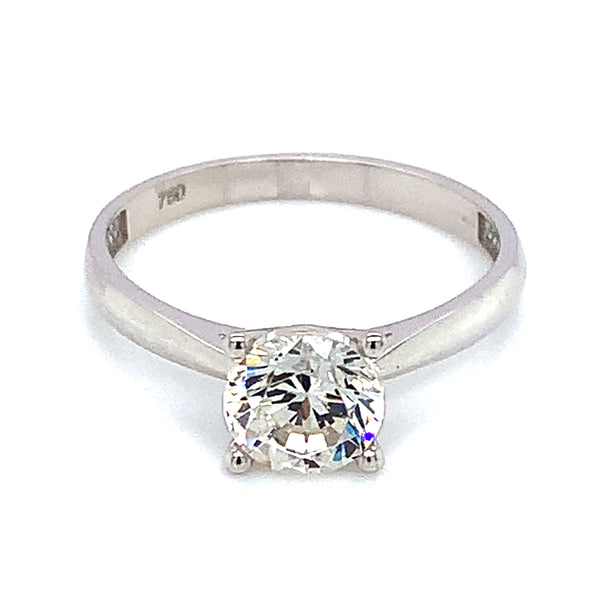 Anillo solitario con circón en oro blanco 18kt.