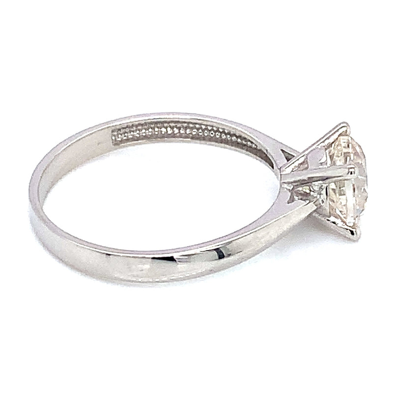 Anillo solitario con circón en oro blanco 18kt.