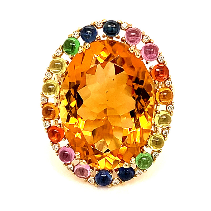 Anillo de citrino con zafiros y diamantes en oro amarillo 14kt.