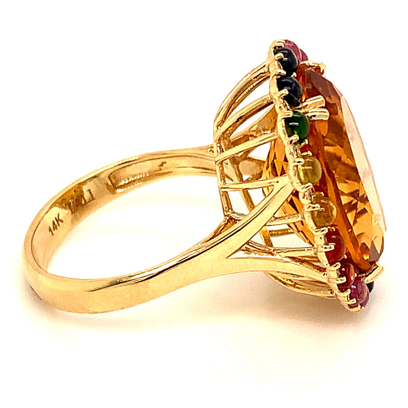 Anillo de citrino con zafiros y diamantes en oro amarillo 14kt.