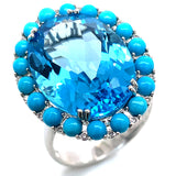 Anillo de topacio azul, turquesas y diamantes en oro blanco 14kt.