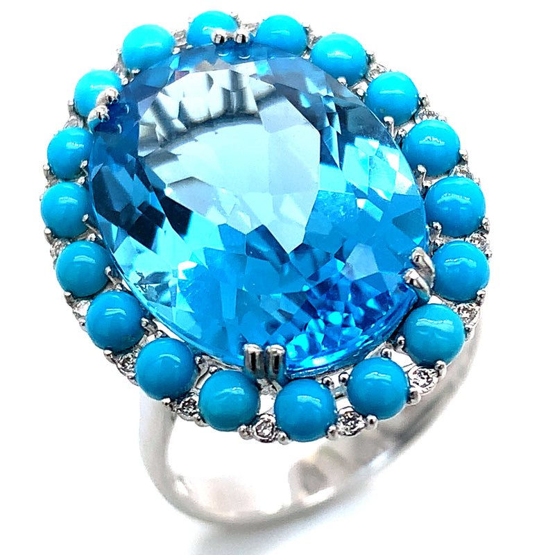 Anillo de topacio azul, turquesas y diamantes en oro blanco 14kt.
