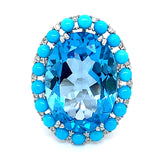 Anillo de topacio azul, turquesas y diamantes en oro blanco 14kt.