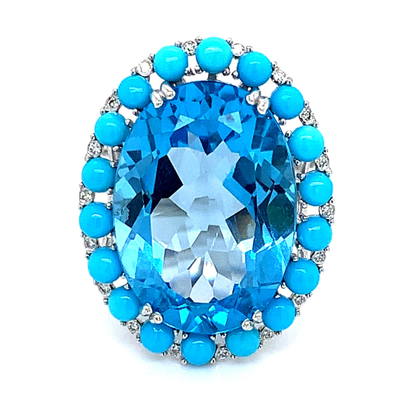 Anillo de topacio azul, turquesas y diamantes en oro blanco 14kt.
