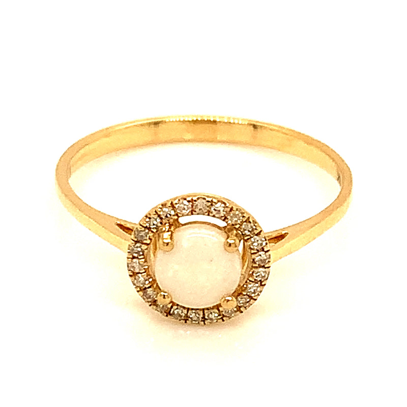 Anillo de opal con diamantes en oro amarillo 14kt.