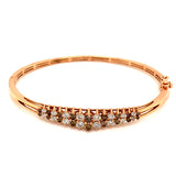 Caña con diamantes coñac y blancos en oro rosado 14kt.