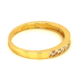 Banda con circones en oro amarillo 10kt.