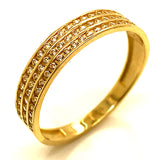 Banda con circones en oro amarillo 10kt.