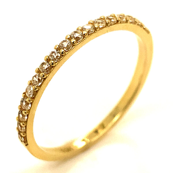Banda con circones en oro amarillo 10kt.