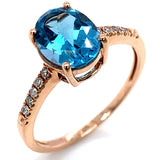 Anillo de topacio azul con diamantes en oro rosado 14k