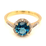 Anillo de topacio azul en oro amarillo 10kt.