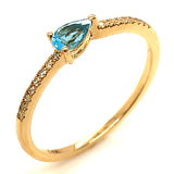 Anillo de topacio azul con diamantes en oro amarillo 14k