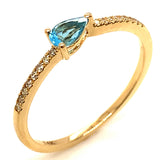 Anillo de topacio azul con diamantes en oro amarillo 14k