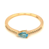 Anillo de topacio azul con diamantes en oro amarillo 14k