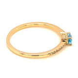 Anillo de topacio azul con diamantes en oro amarillo 14k