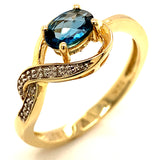 Anillo de topacio azul en oro amarillo 10kt.
