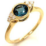 Anillo de topacio azul en oro amarillo 10kt.