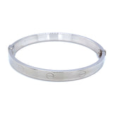 Caña (estilo cartier S) en oro blanco 10kt.