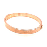 Caña (estilo cartier S) en oro rosado 10kt.