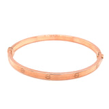 Caña (estilo cartier M) en oro rosado 10kt.