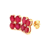 Aretes de rubí con diamantes en oro amarillo 14kt.