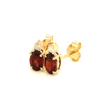 Aretes de granate con diamantes en oro amarillo 14kt.