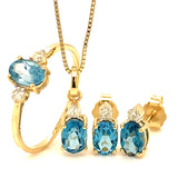 Anillo de topacio azul con diamantes en oro amarillo 14kt.