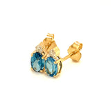 Aretes de topacio azul con diamantes en oro amarillo 14kt.