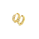 Huggies con circones en oro amarillo 10kt.