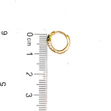 Huggies con circones en oro amarillo 10kt.