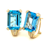 Aretes de topacio azul con diamantes en oro amarillo 14kt.