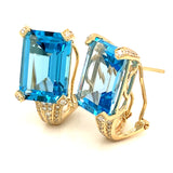 Aretes de topacio azul con diamantes en oro amarillo 14kt.