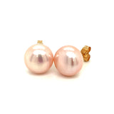 Aretes de perlas rosadas cultivadas en oro amarillo 14kt.