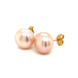 Aretes de perlas rosadas cultivadas en oro amarillo 14kt.
