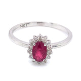 Anillo de rubí con diamantes en oro blanco 14kt. R-0.55CTS. D-0.13CTS.