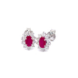 Aretes de rubíes con diamantes en oro blanco 14kt. R-0.55CTS. D-0.38CTS.