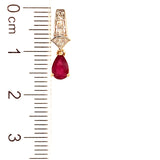 Aretes con rubí y diamantes en oro amarillo 14KT