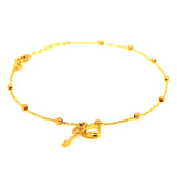Pulsera (bolitas con dijes de llave y corazón) en oro amarillo 10kt. 17/19cm
