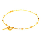 Pulsera (bolitas con dijes de llave y corazón) en oro amarillo 10kt. 17/19cm