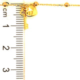 Pulsera (bolitas con dijes de llave y corazón) en oro amarillo 10kt. 17/19cm