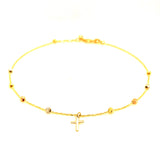 Tobillera (bolitas con dije de cruz) en oro tres tonos 10kt. 23/25cm