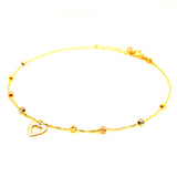Tobillera (bolitas con dije de corazón) en oro tres tonos 10kt. 23/25cm
