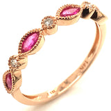 Anillo de rubíes con diamantes en oro rosado 14kt. R-0.60CTS. D-0.04CTS.