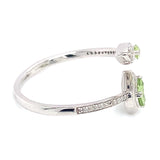 Anillo con peridoto y diamantes en oro blanco 10kt