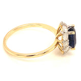 Anillo con zafiro y diamantes en oro amarillo 14KT